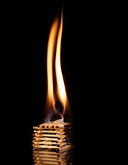 Burning matches on a black background