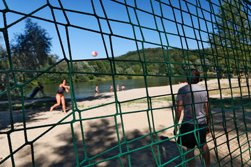 Volleyball on a sandybeach on the banks of the Drava River