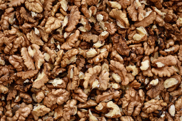 Walnuts background. Seamless pattern. Close up.