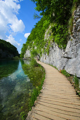 Wooden footbridge built above the blue waters of the Plitvice Lakes National Park in Croatia