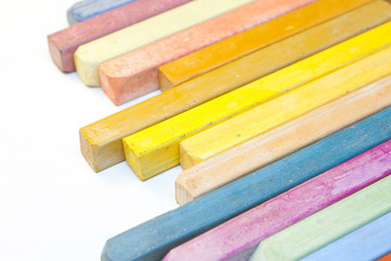 Colourful crayons on white background