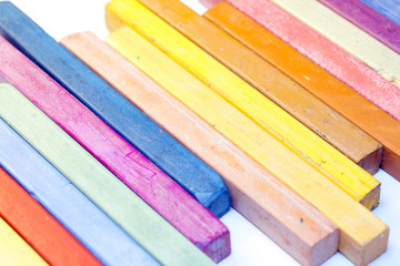 Colourful crayons on white background
