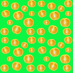  Close-up of fruit cut tangerines on a light green background
