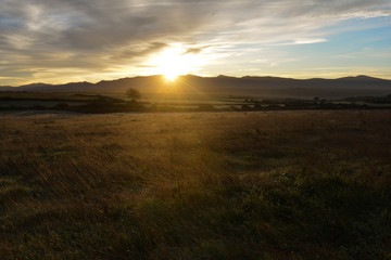 Landscape during sunrise with mountains on the horizon in a small town of Salamanca, Spain