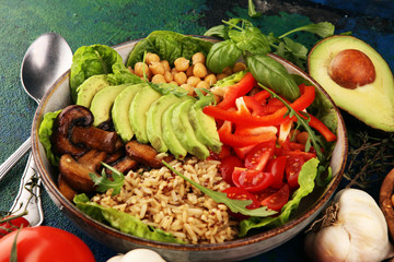 Quinoa and spicy chickpea vegetable vegetarian buddha bowl. Healthy food concept with tomato
