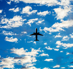 Fototapeta na wymiar Commercial aircraft is flying above