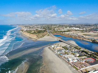 Aerial view of Del Mar North Beach, California coastal cliffs and House with blue Pacific ocean....