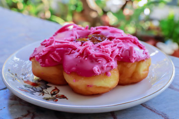 Fancy donuts on a white plate