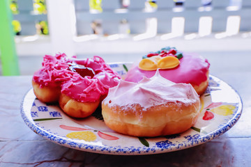 Fancy donuts on a white plate