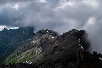 Fototapeta na wymiar Swiss Alps Cloudy Mountains