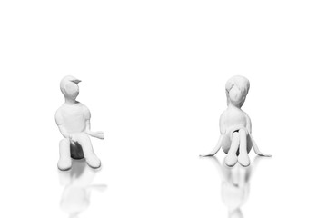 The statues from the white clay is a man and woman who is a lover or couple on a white background.