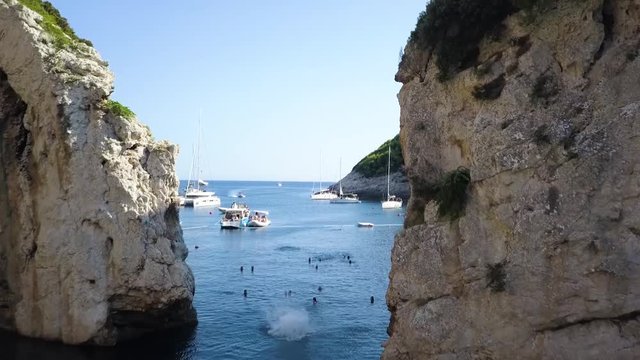 Flying through cliff over water with backflip