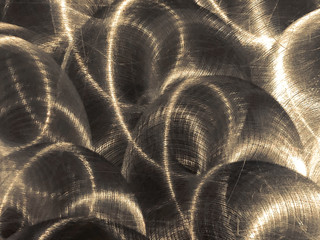 Close up of grungy, industrial brushed metal sheet with circular patterns