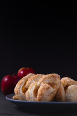 Apples danish pastries on a dark background