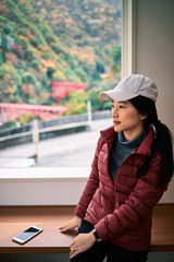 Portrait of Asian women in Unazuki Station at Kourobe Gorge, Toyama, Japan.