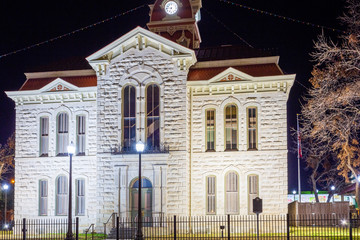 Fototapeta na wymiar Ornate Victorian stone building with clock tower, Lampassas County Court House, Texas
