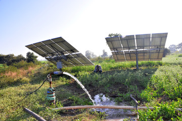 agricultural equipment for field irrigation, water jet, behind which is solar panel's,