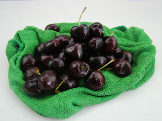 Bunch of fresh cherries on green cloth