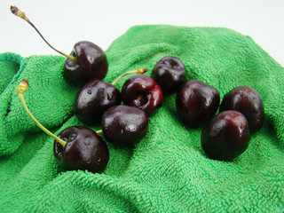 Bunch of fresh cherries on green cloth