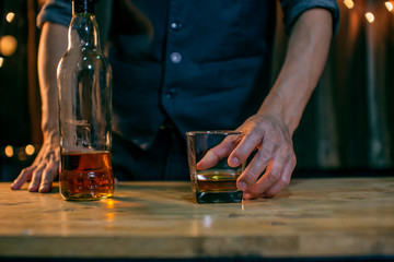 Barman pouring whiskey whiskey glass beautiful night