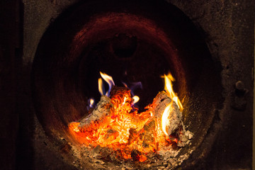 Fire and coals in a round firebox