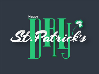 Stylish Creative Text of Happy St. Patrick's Day with Shamrock Leaf on Grey Background.