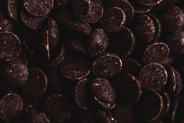 milk chocolate pieces preform candies in daylight for background