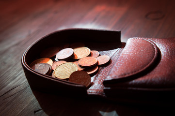 Coins in leather coin tray purse or wallet
