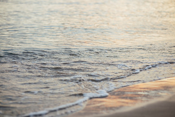 Sea wave close up, low angle view, sunrsie shot