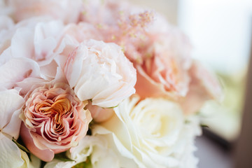 Wedding flowers, bridal bouquet closeup. Decoration made of roses, peonies and decorative plants, close-up, selective focus, nobody, objects