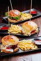 Closeup of home made burgers on wooden background