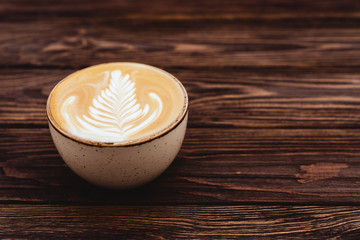 cup of coffee on vintage wood. Top view , cup on wooden table. View from top