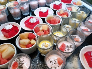 Top view of sweet red strawberry jelly topped with whip cream, chocolate mousse, strawberry...
