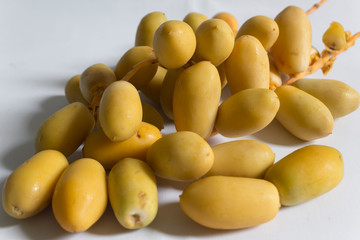 Yellow date palm (Phoenix dactylifera). Raw dates fruit. Top view.