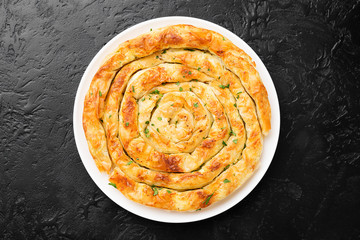 Traditional feta cheese phyllo pastry pie. top view