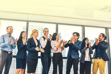 Obraz premium Business people teamwork group are happy finished success business project standing in office congratulation