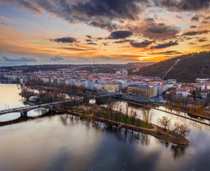 Fototapeta na wymiar Prague, Czech Republic - Aerial panoramic drone view of Strelecky Island with a beautiful winter sunset and colorful sky