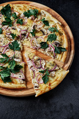 Pizza with champignons on black