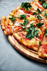 Supreme Pizza with ham and paprika isolated on grey background