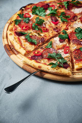 Supreme Pizza with ham and paprika isolated