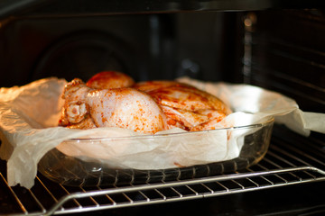 marinated chicken with seasonings in the oven. step-by-step recipe. baked meat in the oven. delicious and juicy white meat. dietary food.the view from the top. space for text.