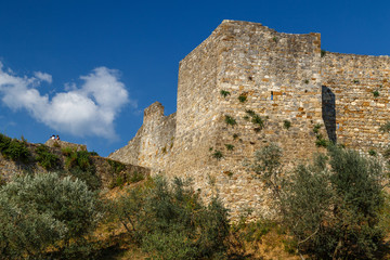 Fototapeta premium Medieval fortification walls tower in San Gimignano town, Italy