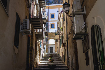 Fototapeta na wymiar Stairs between townhouses on the Old Town of Cefalu city on Sicily Island in Italy