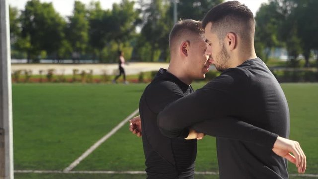 Two fighters practice mma skills in training
