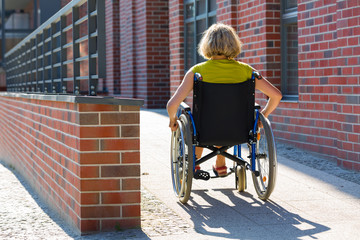 woman on wheelchair entering the platform