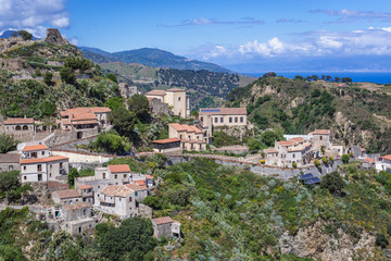Fototapeta na wymiar Aerial view with remains of Pentefur castle on hill in Savoca village on Sicily, Italy