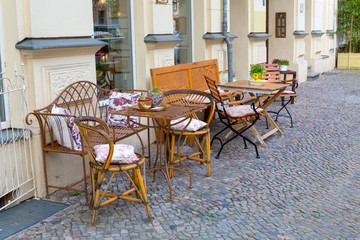 Fototapeta na wymiar tables on the street - cafe bar in Berlin