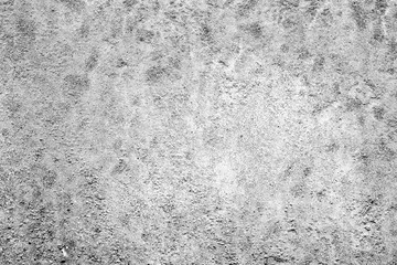 Texture of a concrete wall with cracks and scratches which can be used as a background