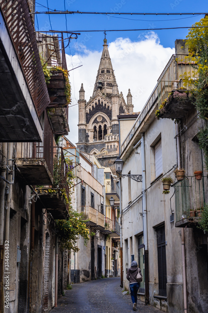 Sticker View from narrow street on a bell tower of Basilica of Santa Maria Assunta located in historic part of Randazzo city on Sicily Island in Italy