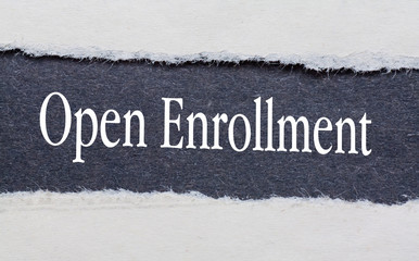 Open Enrollment words under torn black paper.